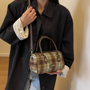 British vintage plaid bowling bag with brown leather handles and adjustable shoulder strap