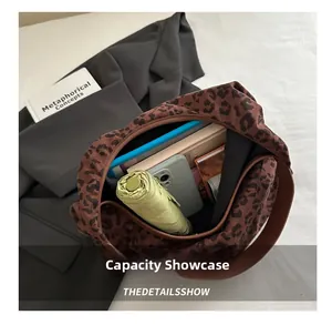 Top view of leopard print tote bag showing large capacity with umbrella and phone inside