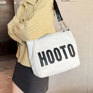 White fuzzy tote bag with HOOTO letter patch and black leather chain straps for winter