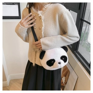 Close-up of cute panda plush bag featuring soft faux fur and adjustable black shoulder strap