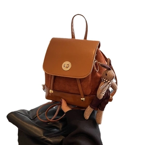 Vintage brown small backpack for women with smooth leather flap and velvet texture