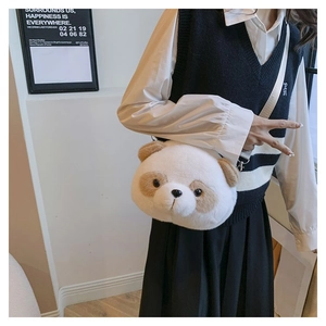 Close-up of cute plush panda crossbody bag with fluffy texture and adjustable gray strap