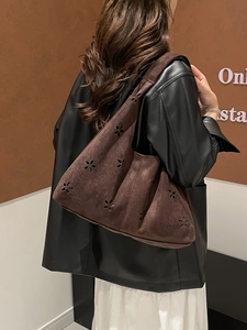 Winter brown suede hobo shoulder bag with laser-cut floral patterns for women