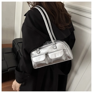 Close-up of liquid silver shoulder bag with double outer pockets and metallic texture