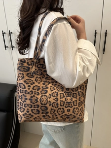 Large leopard print tote bag for women shown as a stylish crossbody shoulder bag
