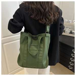 Sac en toile vert olive foncé avec bandoulière réglable et design spacieux