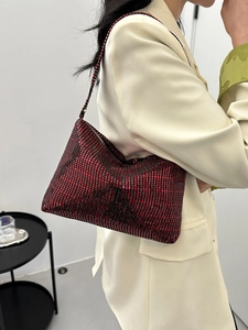 Chic red rhinestone baguette bag with shoulder strap for elegant evening party styling