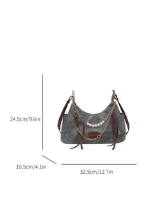 Denim half-moon shoulder bag with pearl chain and brown leather strap details
