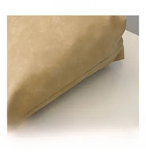 Macro shot of khaki leather bucket bag texture with soft grain and precision stitching