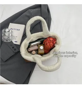Interior view of spacious white lamb wool tote bag showing daily essentials