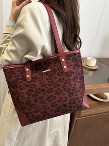Deep red leopard print tote bag for women with gold trim and spacious interior