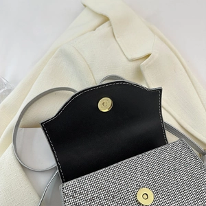 Detail of silver rhinestone evening bag with black leather lining and magnetic clasp
