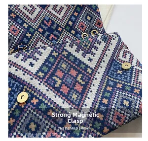 Detail of colorful ethnic weave crossbody bag featuring strong magnetic gold buckles