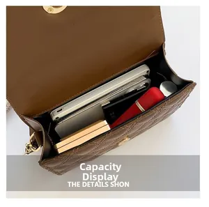 Internal view showing capacity of the brown quilted crossbody bag for daily essentials