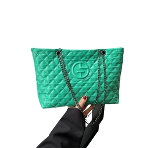 Quilted green leather shoulder bag with diamond pattern and gunmetal chain handles