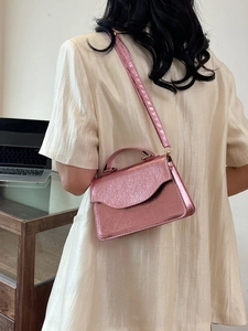 Elegant metallic pink party clutch with top handle and leather shoulder strap
