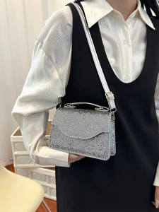 Elegant silver rhinestone clutch bag with adjustable strap for evening parties and events
