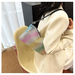 Close-up of vibrant gradient rhinestones and crescent shape on this Y2K shoulder bag