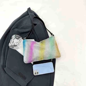 Detail of colorful gradient rhinestones on a stylish women's shoulder bag
