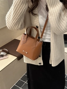 Elegant brown PU leather tote bag with dual handles and adjustable strap for women