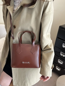 Minimalist brown leather crossbody handbag with fashion metal plaque for women