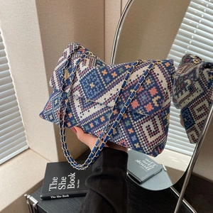 Ethnic style knitted crossbody bag with geometric patterns and chain strap in daily life scene