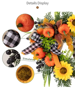 Detail view of harvest wreath featuring mini pumpkins, sunflowers and checkered bows