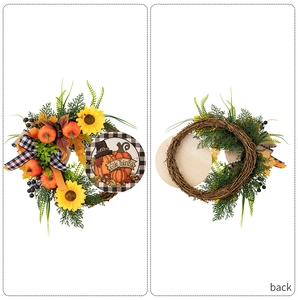 Detail of Give Thanks pumpkin wreath showing sunflower accents and natural vine back