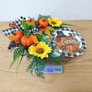 Close-up of a Give Thanks pumpkin wreath showing weight on a digital scale for home decor