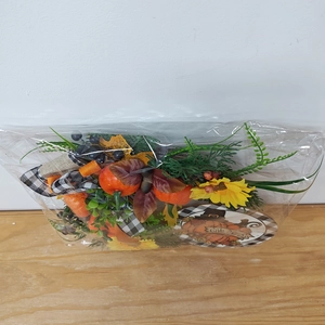Detail of Thanksgiving pumpkin wreath with sunflower berries and Give Thanks sign
