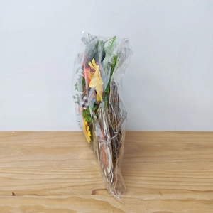 Side view showing the thickness of the Thanksgiving pumpkin wreath with checkered bow