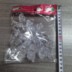 Detailed view of 4cm transparent acrylic Christmas angel ornaments with measuring tape