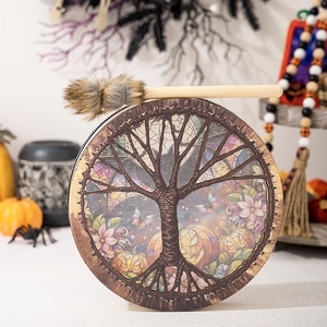 Halloween Tree of Life drum with pumpkin illustrations and a plush-tipped wooden mallet