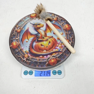 Halloween percussion drum featuring bat and pumpkin motifs with its weight 211.4g