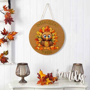 Close-up of Thanksgiving turkey round wooden sign on a wall with autumn decor