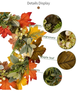 Detail display of autumn wreath with green pumpkins, pomegranates and maple leaves