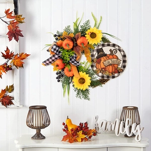Thanksgiving wreath with pumpkins, sunflowers, and Give Thanks wooden sign for front door