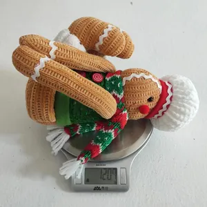 Gingerbread man plush toy weight verification on digital scale showing 120.7g