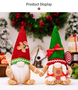 Detail of Christmas gingerbread gnomes with red and green hats on festive background