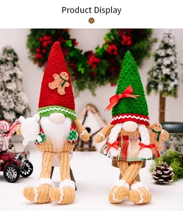 Detail of knitted Christmas gnomes with gingerbread patterns and cozy holiday decorations