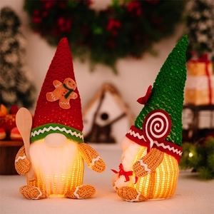 Close-up of glowing Christmas gingerbread gnomes with sequined hats and festive accessories