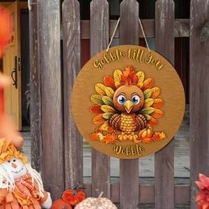 Thanksgiving turkey wooden round door sign with Gobble till you Wobble festive slogan