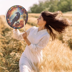 Halloween Shaman frame drum with raven and pumpkin patterns in a golden wheat field