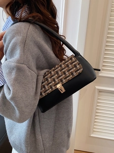 Winter vintage tweed underarm bag with black leather and gold buckle closure