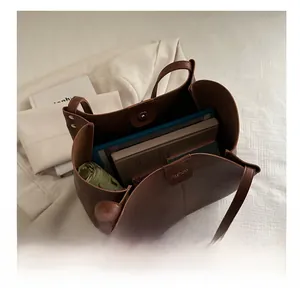 Interior view showing the large capacity of the brown tote bag for daily essentials