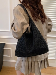 Elegant black leopard print tote bag with large capacity and soft hobo shoulder strap