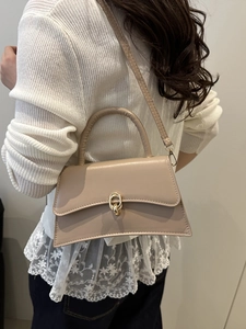 Chic khaki faux leather handbag with gold ring buckle and long crossbody strap