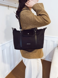 Large black nylon tote bag with leather handles and Fashion & Bag logo for daily travel