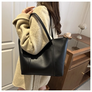Classic large black PU leather tote bag with vertical stitching for daily commute