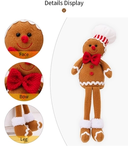 Detail view of gingerbread man plush with chef hat, red bow tie and festive leg design
